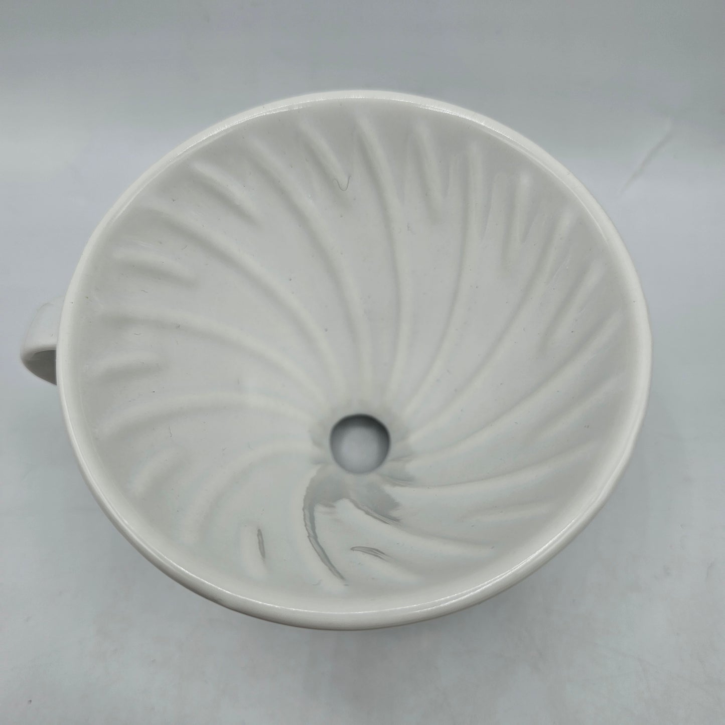 White Ceramic Coffee Pour Over. Sits on Cup to Make a Single Cup of Coffee.