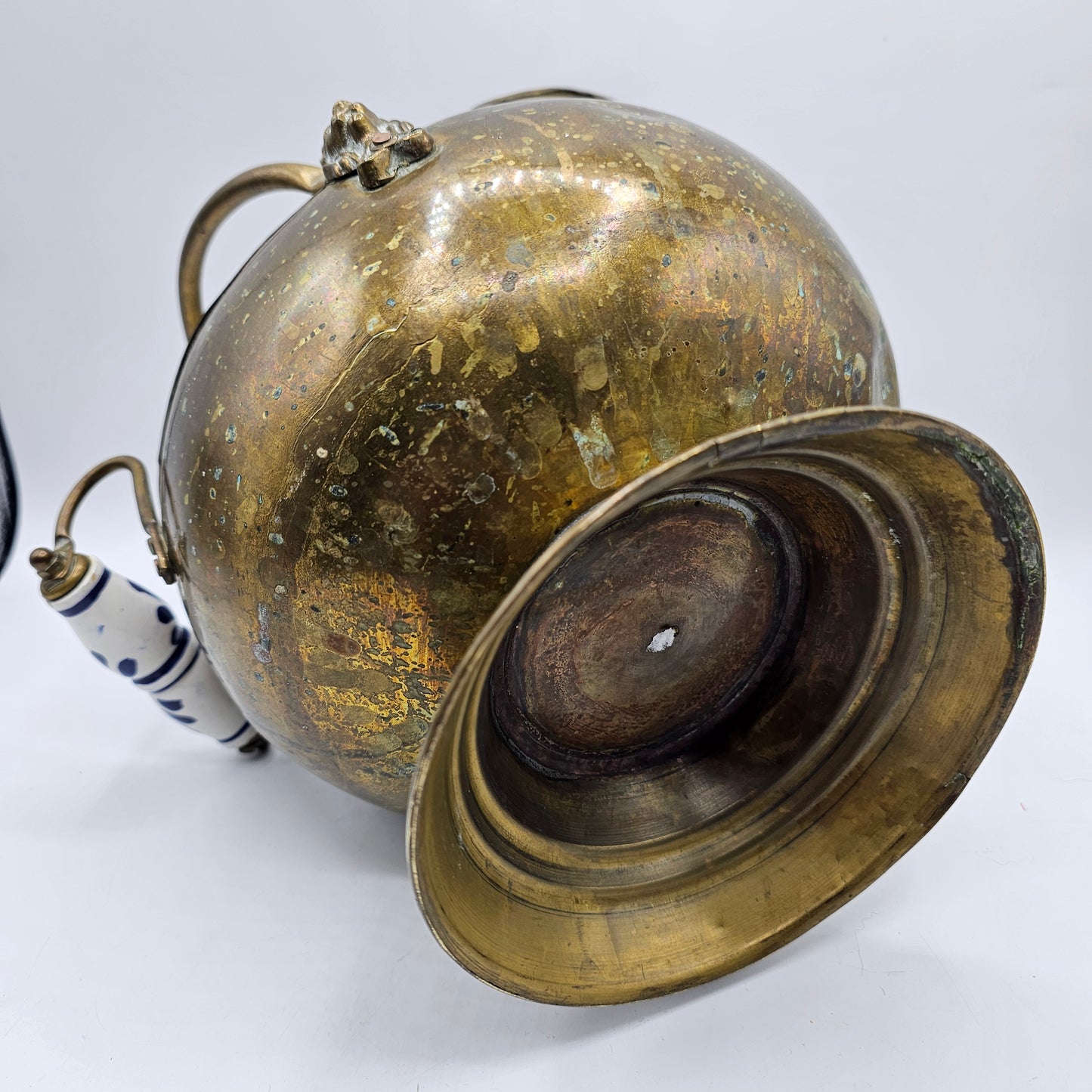 Vintage Brass Fireplace Coal Scuttle with a Blue and White Ceramic Handle and Lion Heads Securing the Handle