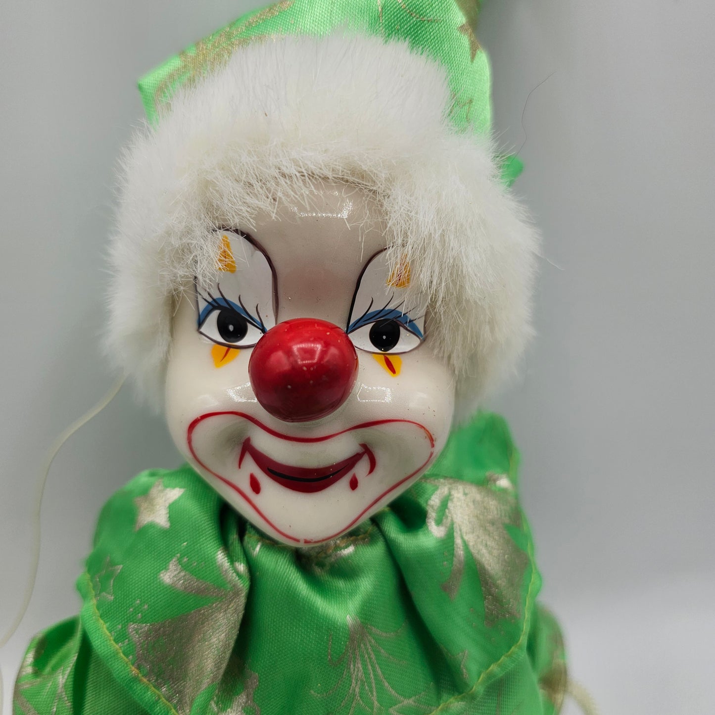Vintage Green Swinging Clown with Hand Painted Ceramic Face