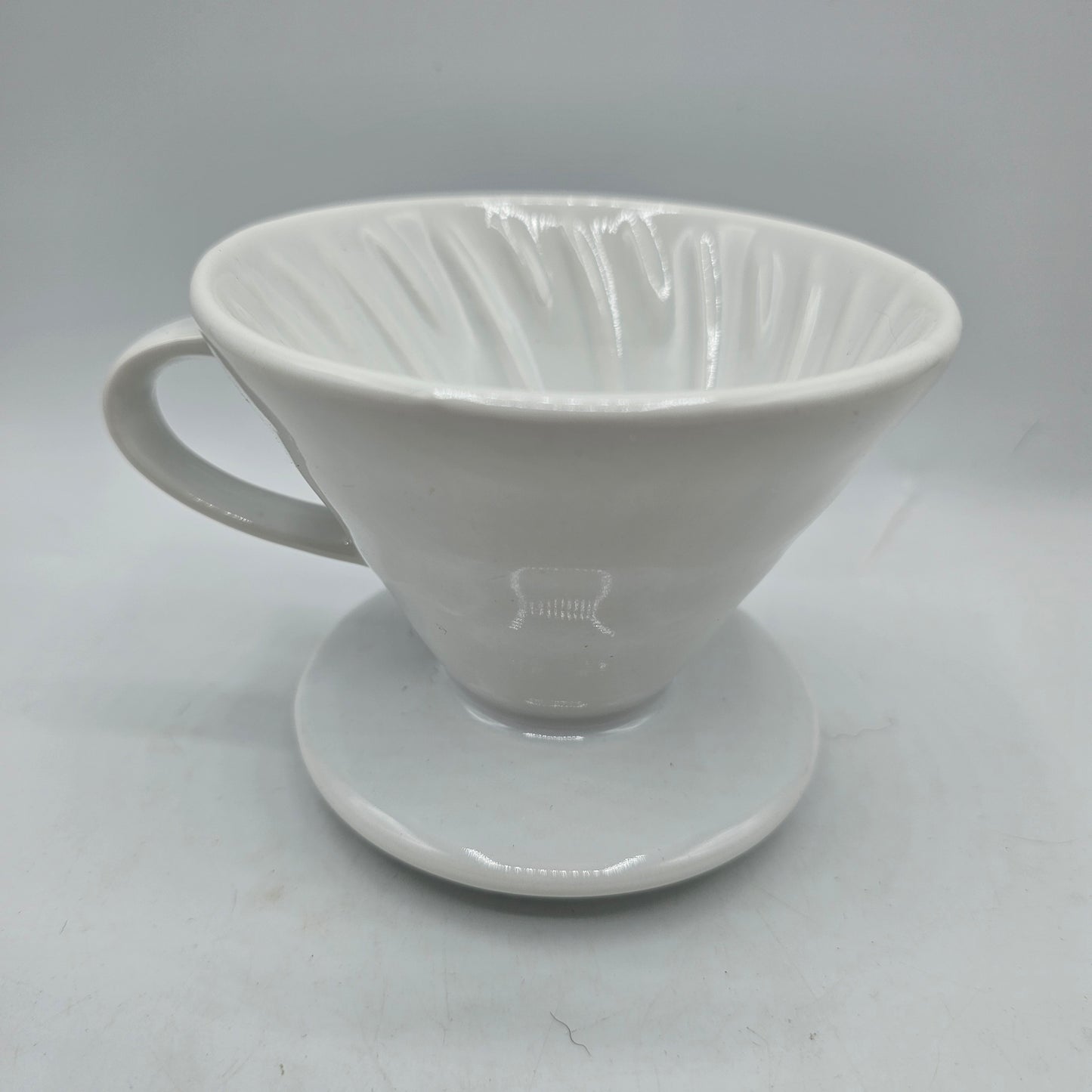 White Ceramic Coffee Pour Over. Sits on Cup to Make a Single Cup of Coffee.
