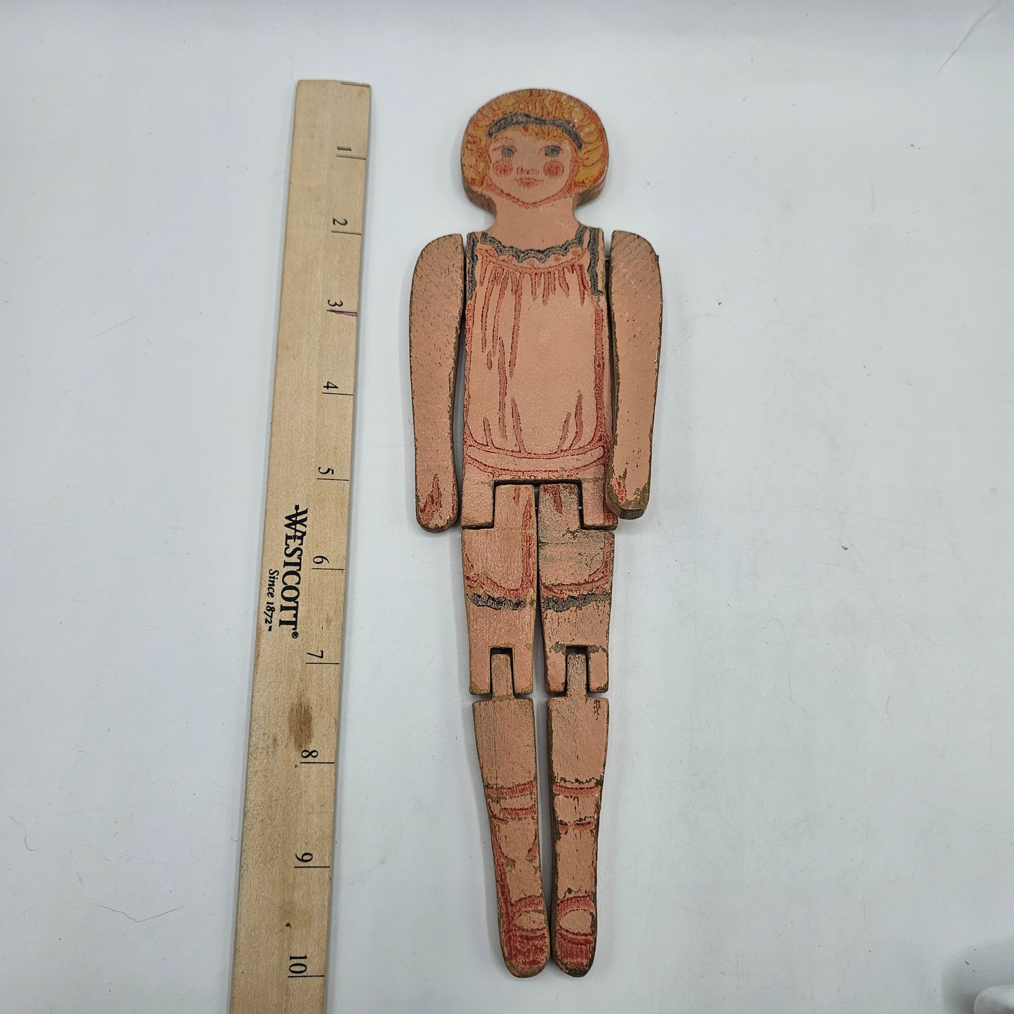Antique Wooden Peg Doll with Articulated Legs and Painted Under Garment Detail