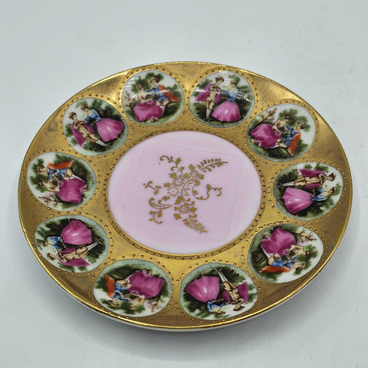 Vintage Royal Vienna Style Porcelain Saucer Featuring a Fragonard-Style Courting Couple Design, Square Cup Indent and Extensive Gold Gilt Trim