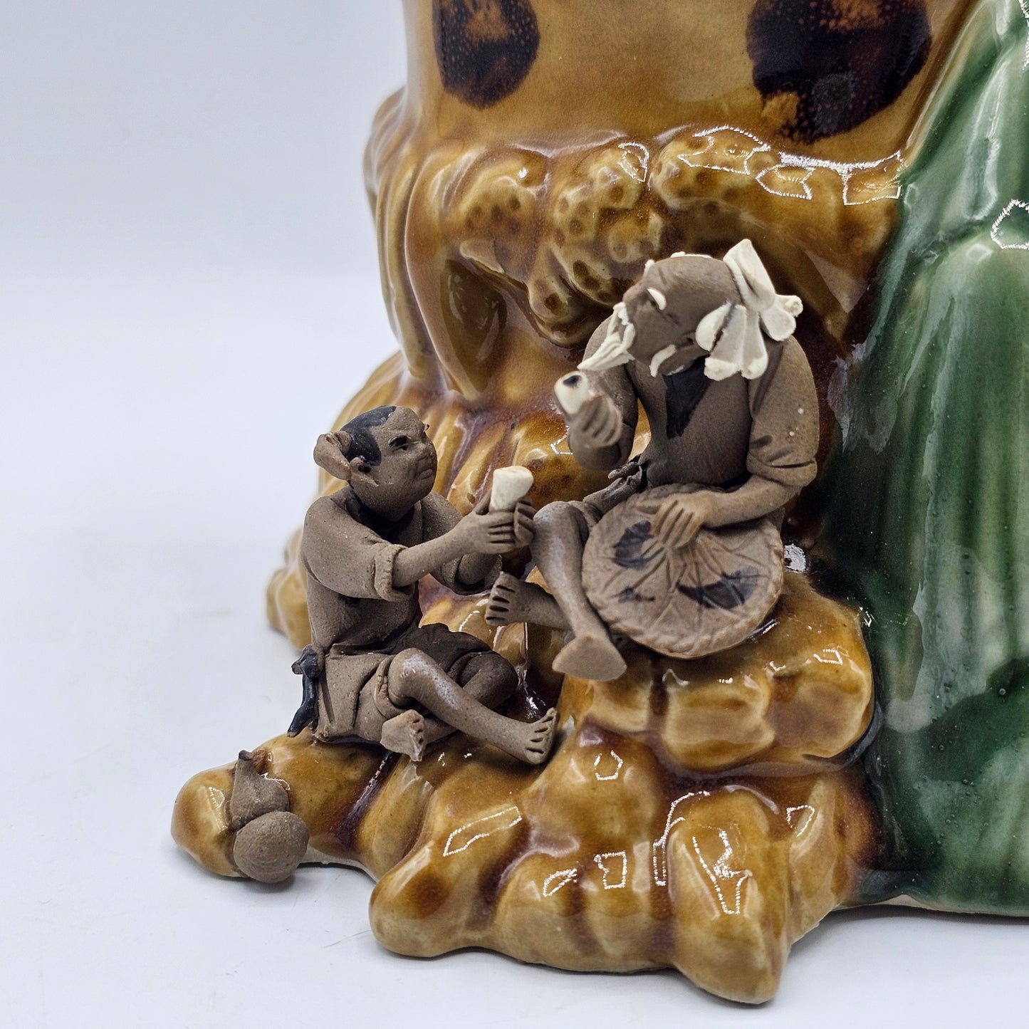 Ceramic Asian Vase with Applied Mud Men Figures