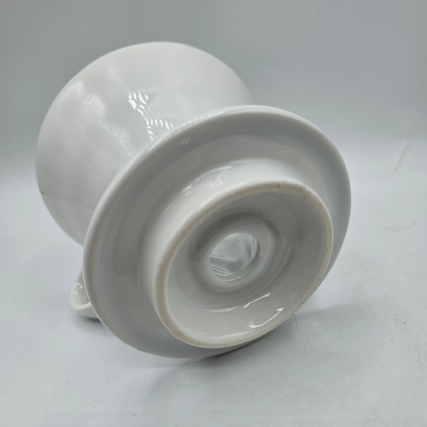 White Ceramic Coffee Pour Over. Sits on Cup to Make a Single Cup of Coffee.