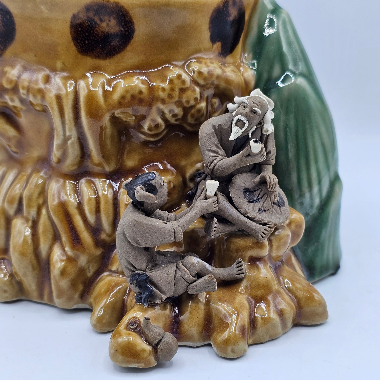 Ceramic Asian Vase with Applied Mud Men Figures