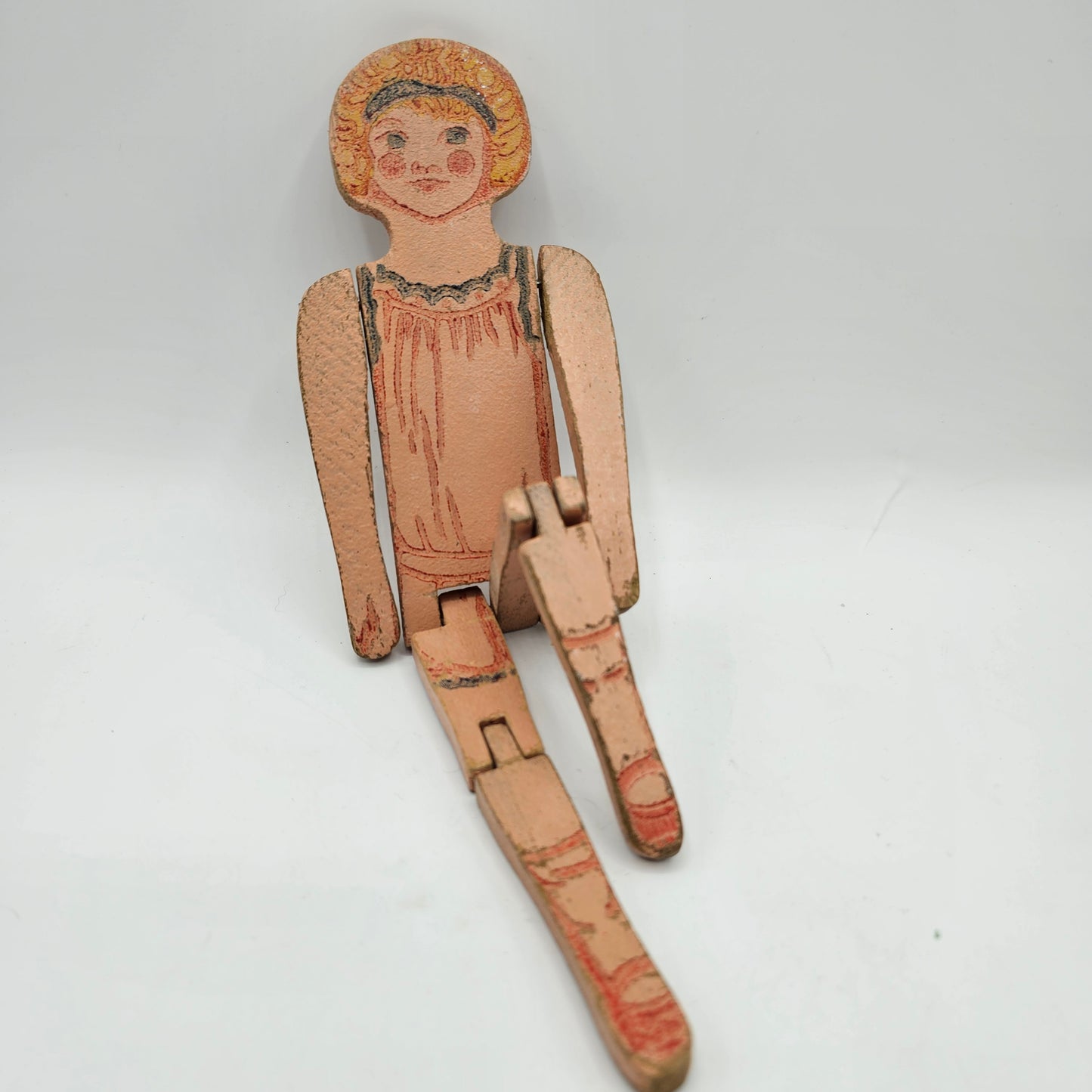 Antique Wooden Peg Doll with Articulated Legs and Painted Under Garment Detail