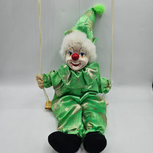 Vintage Green Swinging Clown with Hand Painted Ceramic Face