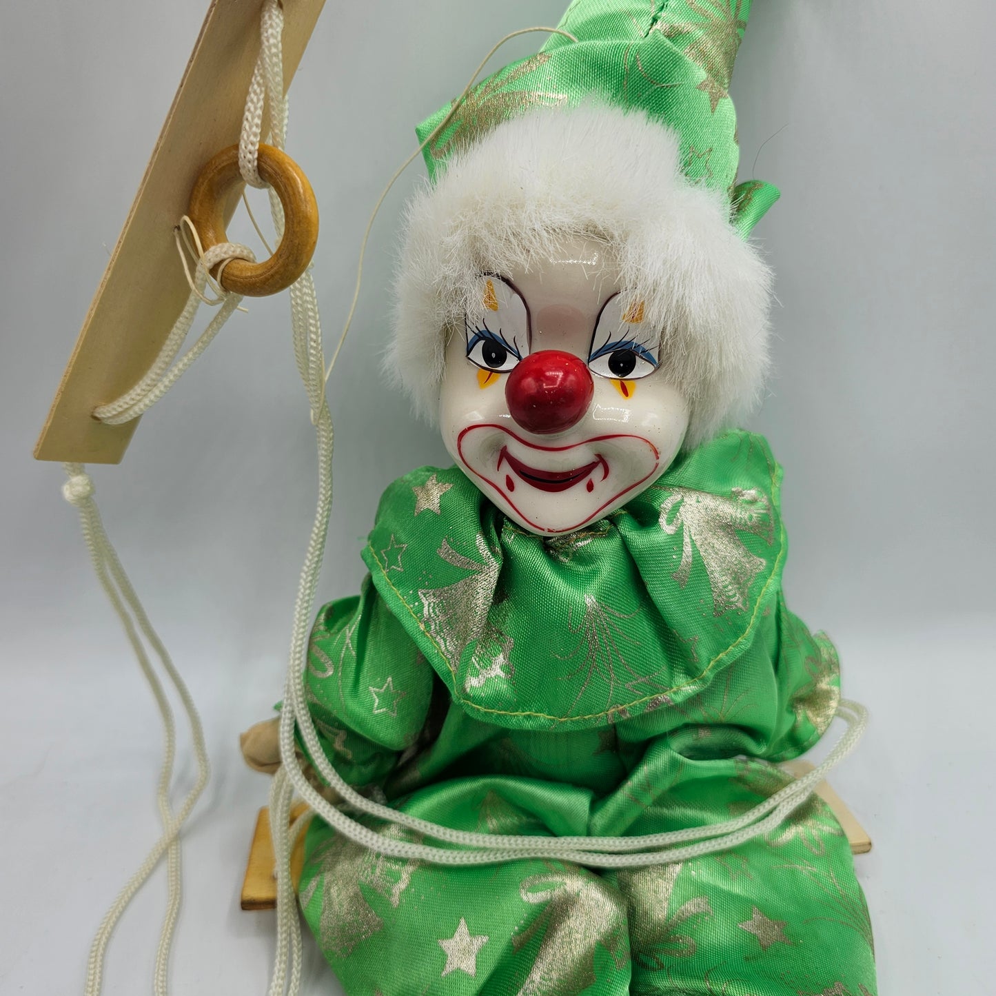 Vintage Green Swinging Clown with Hand Painted Ceramic Face