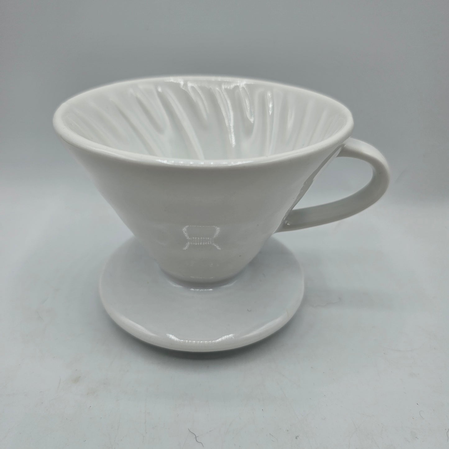 White Ceramic Coffee Pour Over. Sits on Cup to Make a Single Cup of Coffee.